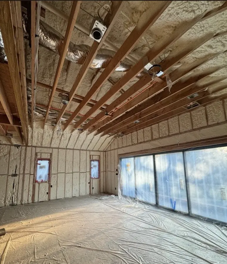 Interior walls and ceiling insulated with spray foam during new construction in Foothill Farms